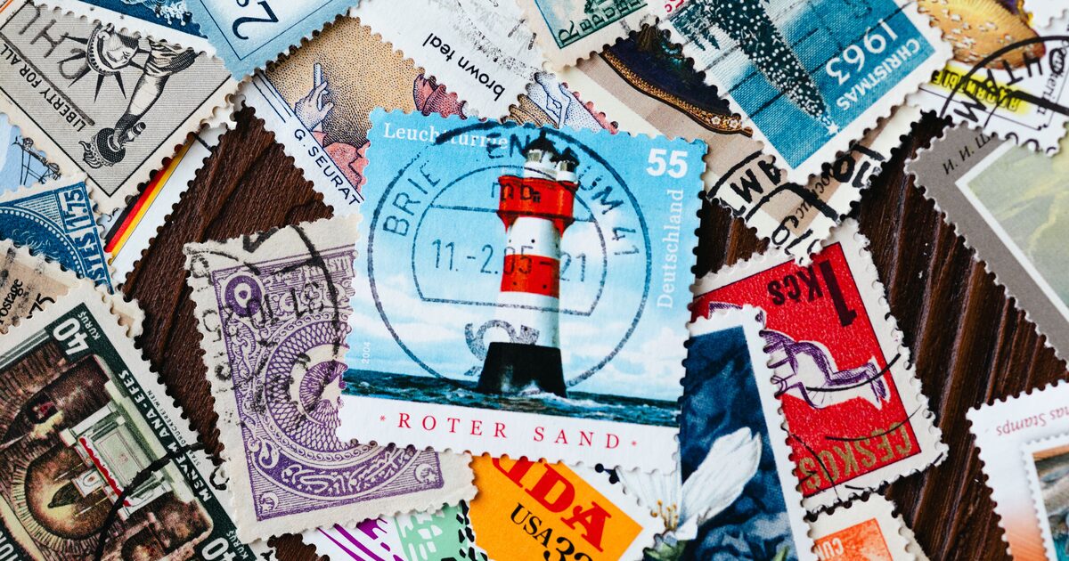 A colourful pile of vintage postage stamps from around the world